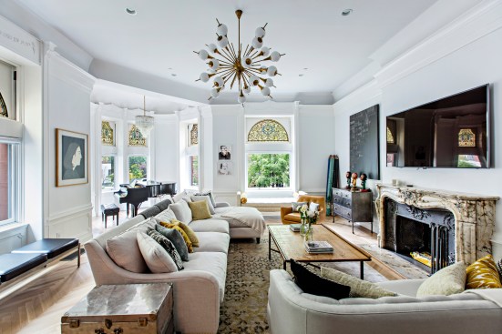 The family room of the home of Tina and John Novogratz and their five kids at 117 8th Avenue in Park Slope, Brooklyn on May 13, 2016. Artwork artists’ credits clockwise from left to right: Alex Katz (Portrait in wooden frame), Aris Moore (2 smaller portraits), Pakpoom Silaphan (large black painting), Rachel Perry Welty (confetti).CREDIT: Dorothy Hong for The Wall Street JournalPhoto Assignment ID: 43626 Slug: BALANCE SHEET-NOVOGRATZ
