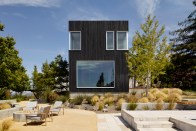 The two-story addition is clad in shou-sugi-ban (burnt Japanese wood).