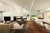 Remodel of Edina Mn residence, PK architects, Streeter and Associates, Andrew Flesher Interiors, ©Karen Melvin Photography, modern, contemporary, white, white kitchen, pizza oven, fireplace modern, monochromatic, woods, woodfloor, modern lamps, feather chandelier, feather pendant, poolside, Womb Chair, wire chair, remodel, remodel modern, architecture minnesota, AM cover