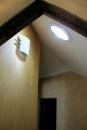 Participants in Solar Energy International's programs on sustainable home design learn about the benefits of implementing daylighting strategies. One way to help cut down on the use of electric lighting during the day is to install tubular skylights, such as the one shown above that is in a hallway of a private residence.