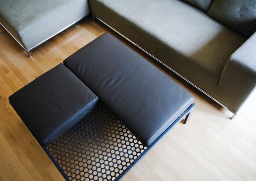 Alla Kazovsky Architects' new Perforations line of furniture and accessories explores the use of perforated steel paired with other materials to make versatile pieces. Featuring end tables, conference tables, partition screens, and sculptures, the collection celebrates the two-sided nature of the material. Each product can be used in multiple ways and material combinations. The On the Level coffee table (shown) is made up of rectangular steel tubing and a sheet of perforated steel. It can also be used as an ottoman when the accompanying square and rectangular leather cushions are added.

designedrealestate.com