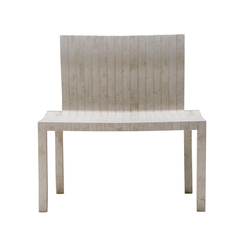 Created by Japanese architect Shigeru Ban for Artek, the modular 10-Unit System is based on L-shaped units that can be combined in different ways to make a chair, a table, or a bench. The chair and table each require 10 units, while the bench requires 20. Made of UPM ProFi, a wood-plastic composite of recycled paper and plastic, the furniture can be disposed of by incineration. Black and white are the standard colors; the chair measures 33" tall, 16" wide, and 17" deep, while the table is 27-1/2" square. The bench is 33" high and 31" wide. artek.fi