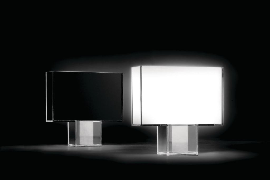 Tati, a new line of table lamps from Kartell, features a squared-off Art Decostyle shape. A transparent polycarbonate body encases an internal diffuser available in full-color methacrylate, opaline, and black or in pleated fabric. A chrome steel weight offers additional support. Its light intensity is fully adjustable. Tati is lamped with a 22W T5 ring and measures 47" wide by 46" tall by 15" deep. It was designed by Ferruccio Laviani. kartell.com