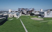 A photo montage showing Pterodactyl (center), with Umbrella at right, with greenery replacing parking on grade.