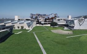 A photo montage showing Pterodactyl (center), with Umbrella at right, with greenery replacing parking on grade.