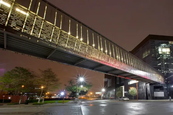 Bridge upper panels in Stainless Steel with Sandstone finish and custom Eco-Etch pattern; lower panels in Stainless Steel with Sandstone finish and custom screen pattern at the Houston Ballet Center for Dance, Houston, Texas