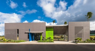 The main, planar facade of the HWC defines the three main components of the facility, with education pavilion at the far right, open-air lanai and native species garden in the middle and treatment facility on the left