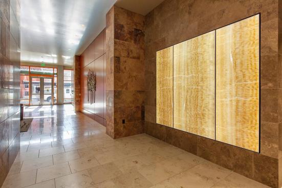 LightPlane Panels in ViviStone Honey Onyx with Pearlex finish shown illuminated at the Woolworth Building, Eugene, Oregon