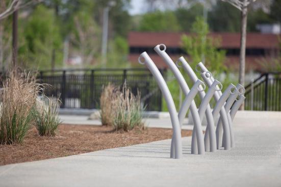 Bike Garden Bike Racks shown in cast-in-place configuration with Aluminum Texture powdercoat at Historic Fourth Ward Park, Atlanta, Georgia