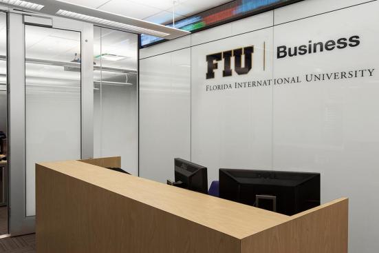 LEVELe Wall System with Blind panels; insets in ViviGraphix Spectra glass, custom pattern interlayer, Standard finish, ViviChrome Chromis glass, White interlayer, Standard finish; door with stiles and rails in Stainless Steel, Sandstone finish, inset in ViviGraphix Gradiance glass, Scatter interlayer, Standard finish at Florida International University - Ryder School of Business, Media Labs, Miami, Florida