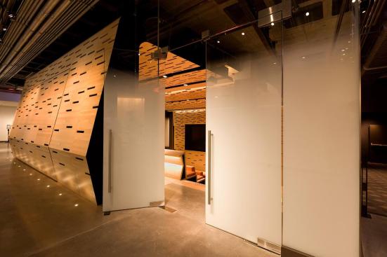 Doors and transom in ViviGraphix Gradiance glass with Standard finish and Scatter interlayer at the Elinor Bunin Munroe Film Center in New York, New York