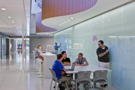 The opaque glass writing wall provides an informal classroom work surface.