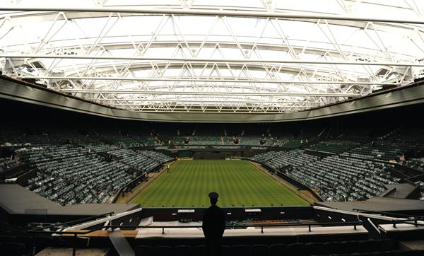 The renovations to Centre Court at London?s All England Lawn Tennis Club, home of the Wimbledon Championships, included the installation of a 56,000-square-foot retractable roof and increased the capacity of the stadium by 1,200 seats.