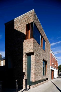 Play on weight of brick as it turns to address the laneway