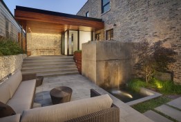 Outdoor area with elegant waterfall, eating area, and spacious sitting room
