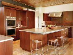 The kitchen is defined by freestanding banks of millwork.