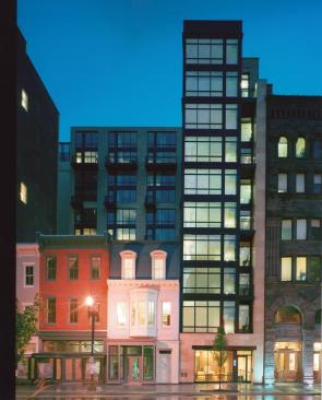 Maintaining the scale of its traditional neighbors, this modern building promotes social interaction with floor-to-ceiling glass windows and Europeanstyle balconies.