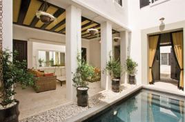 The house has ample outdoor spaces designed for privacy. Moroccan tilework and Latin American and Mediterranean-inspired architectural details are prevalent throughout.