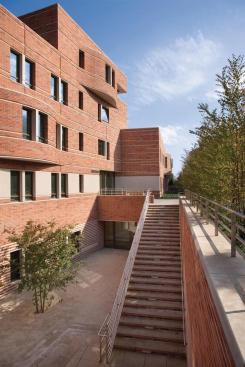 Stairs mediate the two ground levels.