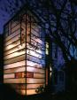 To bring light to this dark row house, David Jameson, AIA, inserted 1 1/4- inch-thick acid-etched glass into a thin-profile steel volume. Transparent vertical glass panels permit views to the rear and sides of the site.