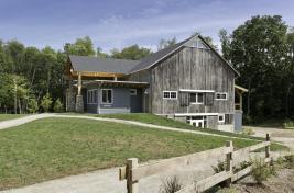 +Side+view+of+the+Timber-Frame+Barn+at+Kalamazoo+Nature+Center+camp+shows+the+barn+with+its+new+front+and+back+additions.