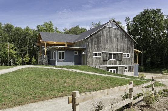 +Side+view+of+the+Timber-Frame+Barn+at+Kalamazoo+Nature+Center+camp+shows+the+barn+with+its+new+front+and+back+additions.