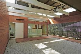 The homes offer three courtyards, cypress siding, bamboo countertops, and waxed concrete floors.