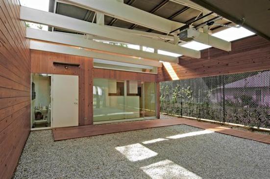 The homes offer three courtyards, cypress siding, bamboo countertops, and waxed concrete floors.