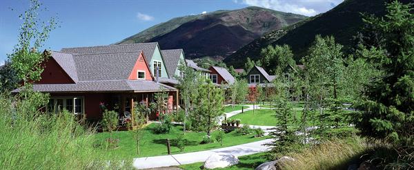 Lipkin Warner designed these cabin-style affordable homes with public spaces that allow pedestrians to enjoy the bucolic splendor of wetlands and old growth spruce and cedar.