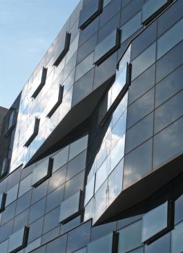 The rippling facade is meant to be experienced as you walk by it. 