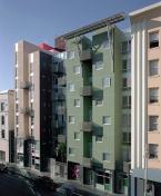 The street-level facade is a varied kit of parts that includes two retail spaces and a lobby. The architects did their own graffiti.