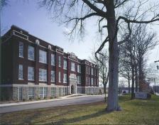 Sherman-Carter-Barnhart Architects faithfully preserved all the generous window openings and exterior details in the school-to apartment conversion.