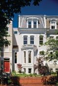 The homes stately, Second Empire style street elevation is barely changed.