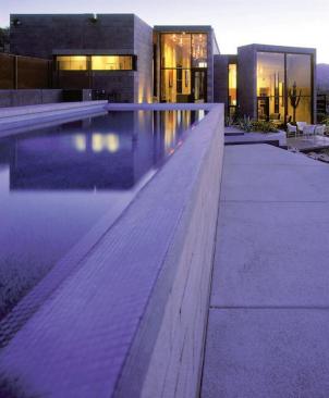 Each of the home's three terraced levels contains a distinct room type public areas, circulation, and private spaces.