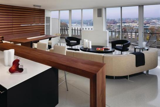 The living room is oriented toward views of the Potomac River and Key Bridge. 