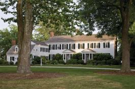 The 1784 historic plantation house has twin Georgian entry porches and a one-room-deep linear plan typical of Virginia Tidewater homes.