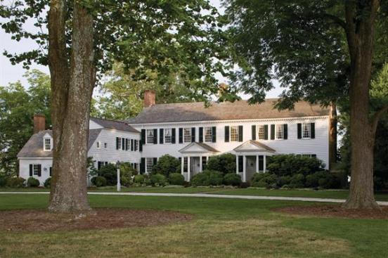 The 1784 historic plantation house has twin Georgian entry porches and a one-room-deep linear plan typical of Virginia Tidewater homes.
