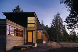 Bedroom window bays are canted toward Olympic Mountain views.