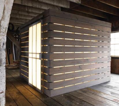 By night, the glowing bath cube becomes a destination for guests in need and a night light for owners.