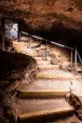 Illuminated cavern stairway.