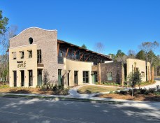 Street View. The structure is a combination of single story and two story masses, each in response to the functions within.