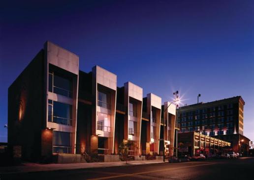 Scale and mass helped these five modern townhomes play nice with the existing structures in a Memphis arts district.