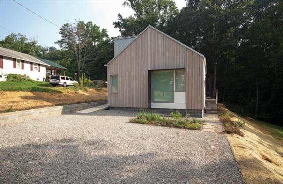 The modular home is made from two modules with a marriage line running vertically from the peak of the gable.