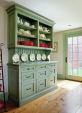 This kitchen remodel by Platt Builders (plattbuilders.com), in Groton, Mass., includes a hutch that blends with the historical home’s period style but that conceals a recycling center and drawers that reach back into the under-stair space.
