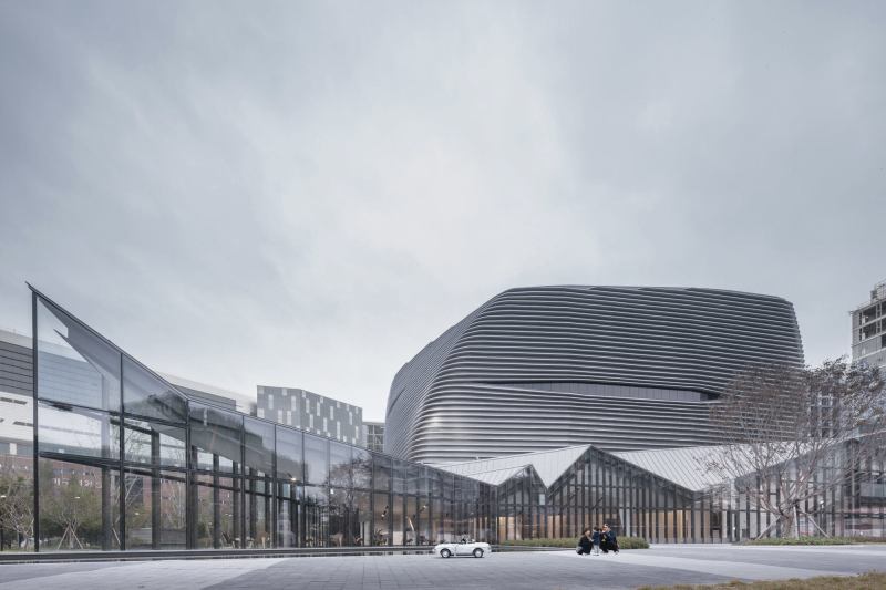 The gallery has to do more than showcase model apartments, it also serves as a civic structure, with a plaza to attract area residents.