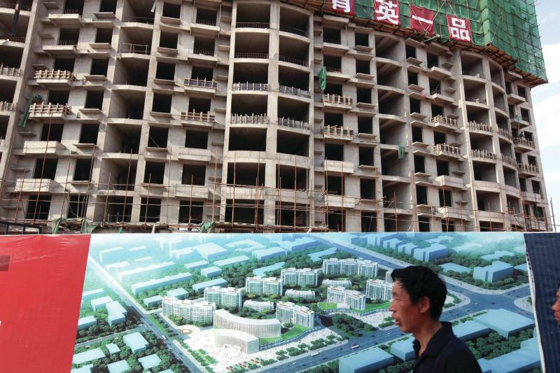 Apartment buildings under construction in the Kangbashi district of Ordos, one of China’s notorious ghost cities.