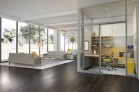 Flow, a workspace module from Steelcase designed in collaboration with author Susan Cain, houses seating, desk space, and integrated media behind a wall of privacy glass. The latter feature is not shown in this image.
