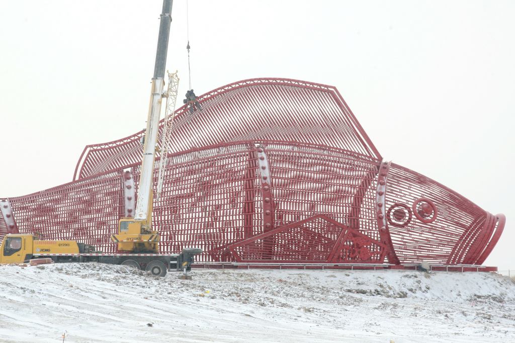 Chinese workers are building a giant steel carp in preparation for the 2015 Harbin Ice and Snow World in Harbin city, northeast China's Heilongjiang province. The fish, 40 meters long, 10 meters wide and 13 meters tall, will feature an ice slide inside to entertain visitors and will be applied by the organizer for a Guinness World Record as the world's biggest steel-made carp.