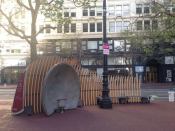 Two concrete bandstands face off one another across a plaza, allowing people seated inside them to hear each other across the way.