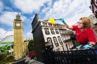 Model maker Katrina James dusts 10 Downing Street at Legoland Windsor Resort in England during the park's annual September cleaning.